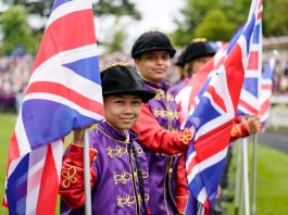 70 Local schoolchildren dressed in the Queen's silks