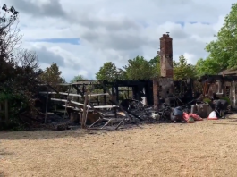 The remains of the fire that devasted a bungalow at his Old Malthouse stables in Upper Lambourn