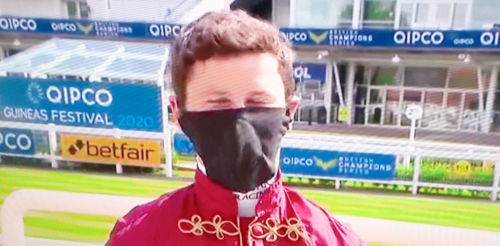Masked jockey Oisin Murphy.