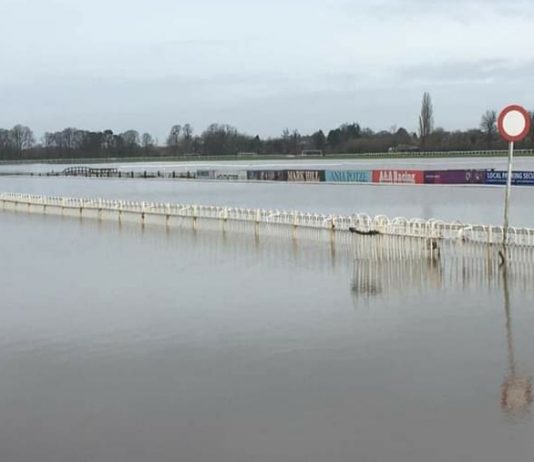 At Worcester racecourse, continuous heavy rain has left the track under water.