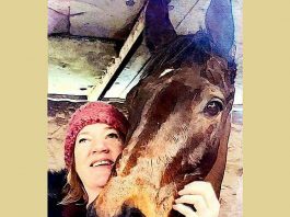 Byrony helping trainer Linda Russell as a stable lass.